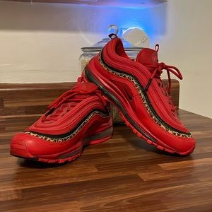 Women’s Nike Air Max 97. In red and a cool leopard print edge. Light wear.